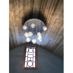 RONDEL WINDOW AND CHANDELIER ENTRY WAY OF A HOME
